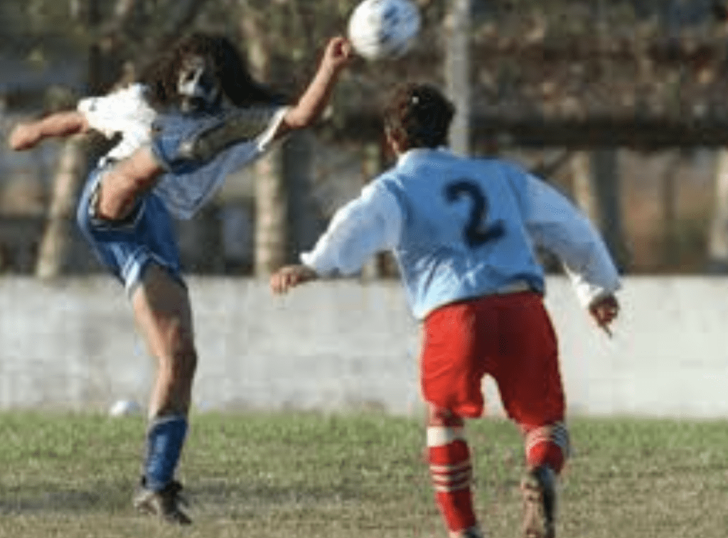 Dario Dubois kicking the football in a match