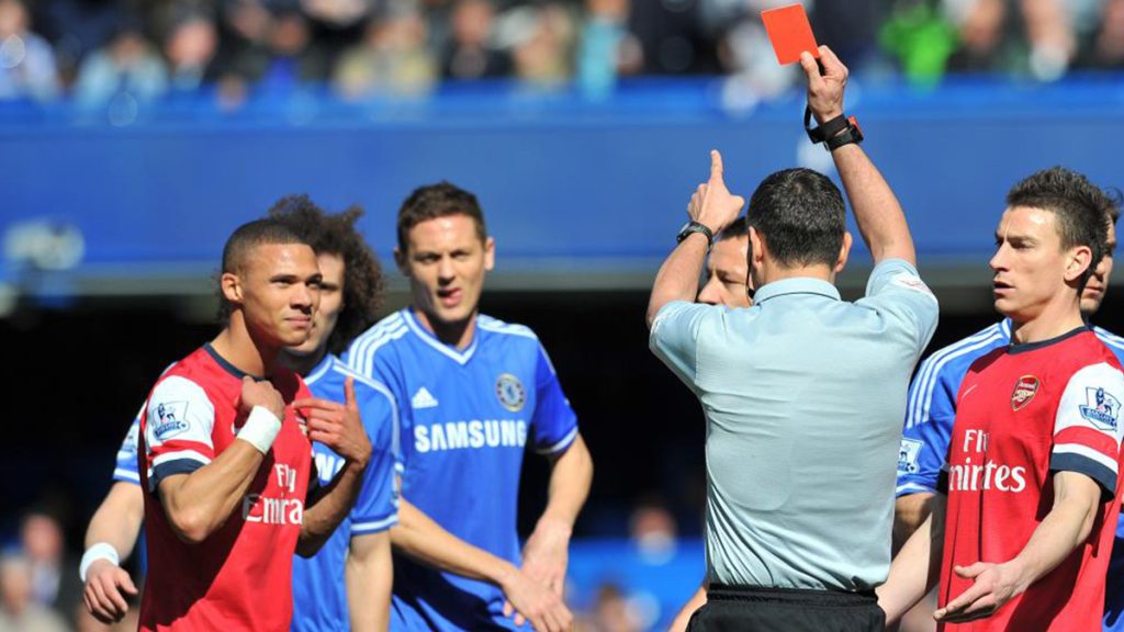 Keiran Gibbs cant believe he is the receipiant of a red card