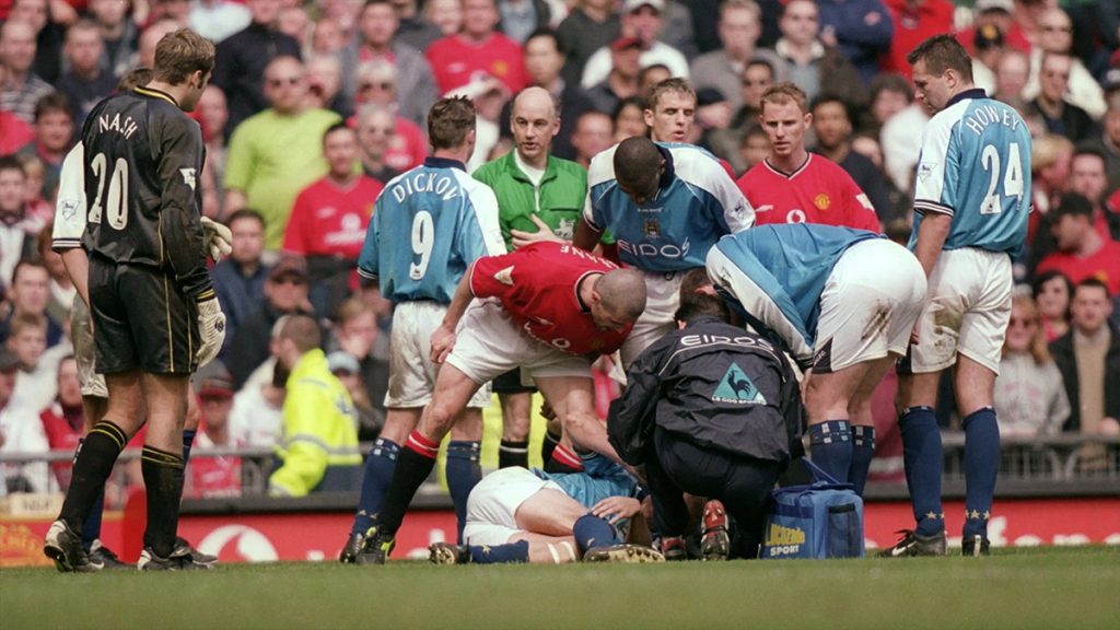 Roy Keane berates an injured Haaland on the ground from his crunching tackle