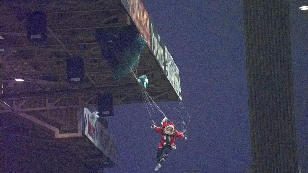 A parachuted laiden Santa crashes to the ground at villa Park
