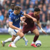 James Tarkowski battling against Omar Marmoush