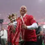 Arne Slot lifting Premier League trophy for Liverpool