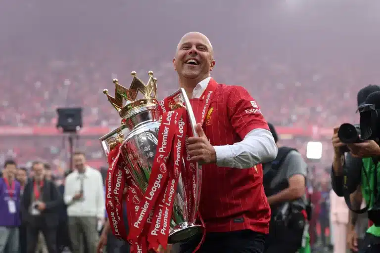 Arne Slot lifting Premier League trophy for Liverpool