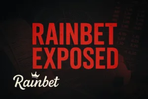 Featured image showing bold red ‘Rainbet Exposed’ text with football and gambling motifs on a dark background.